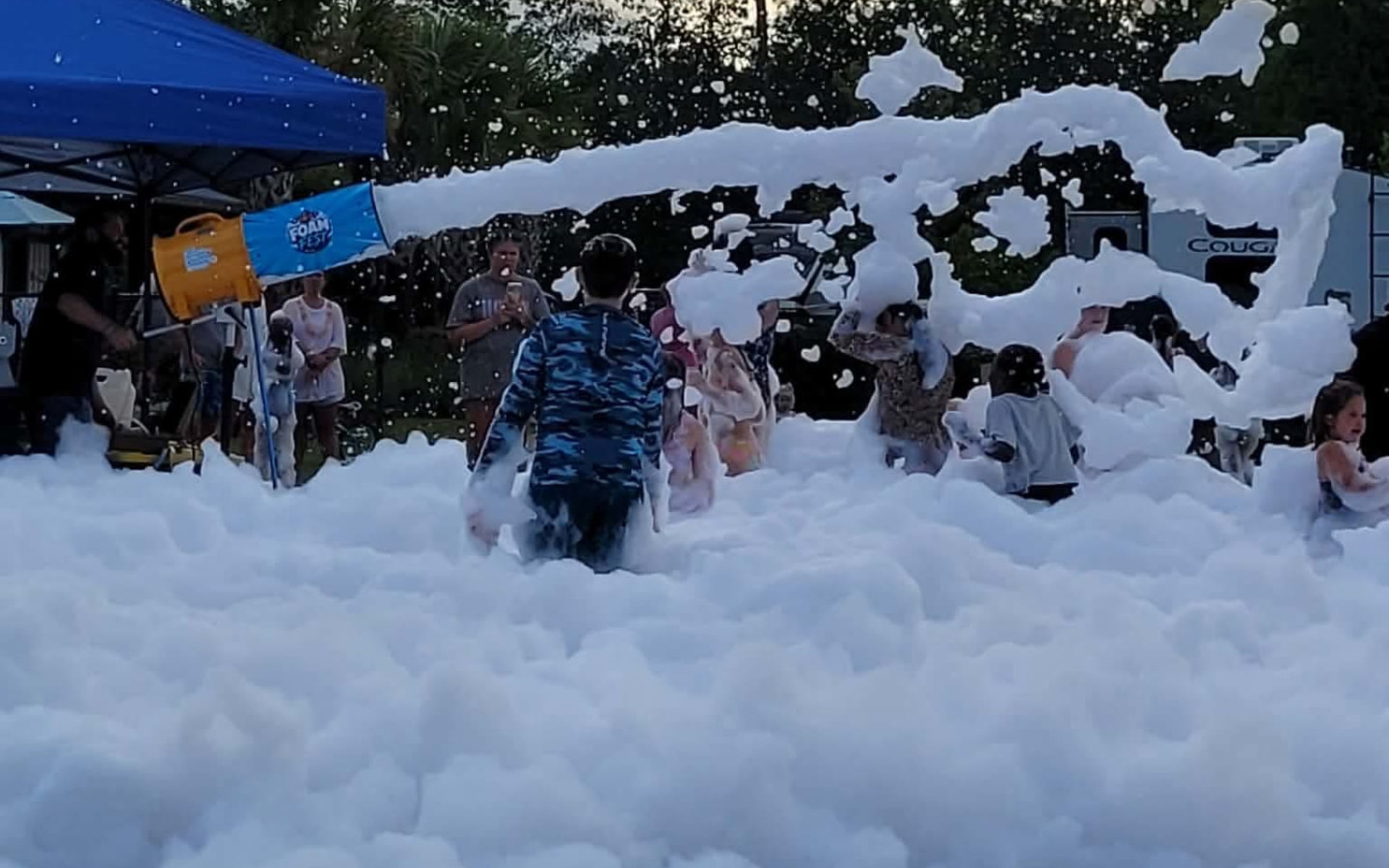 Kids playing in a Foam Fest foam party